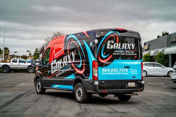 Galaxy Heating & Cooling commercial van with full-coverage branded fleet wrap
