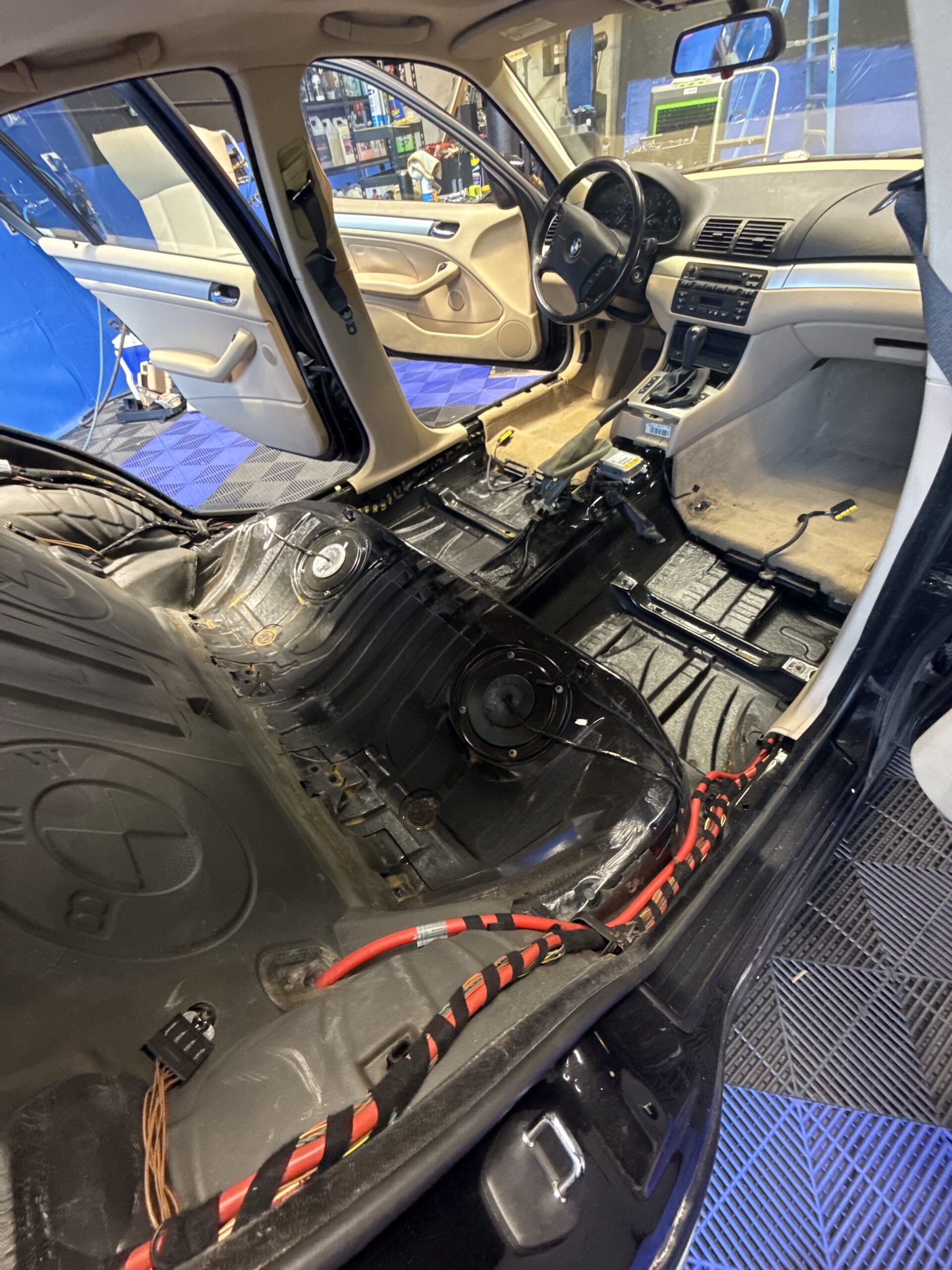 Technician inspecting vehicle before film install