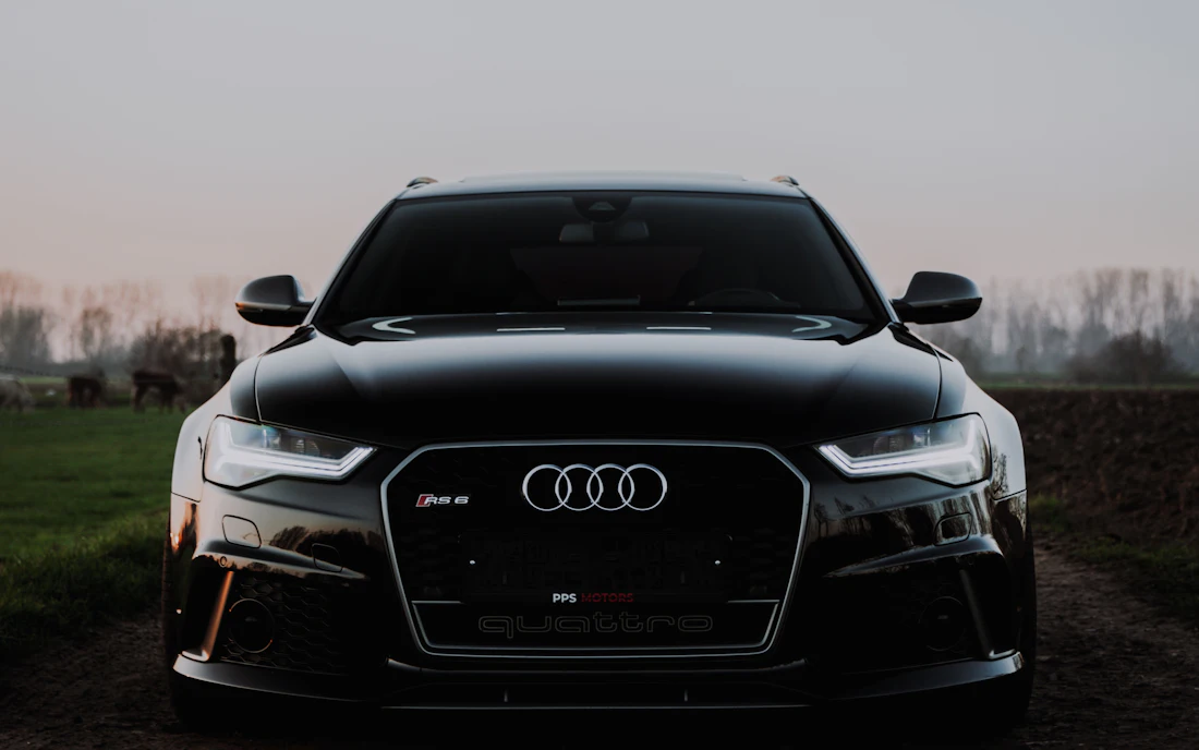 Dark Audi sedan with a deep, non-reflective matte-style finish