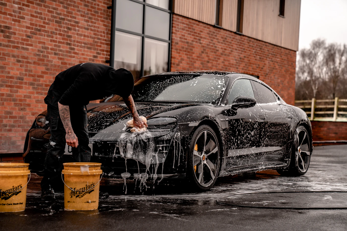 Avid Auto Detailing technician deep-cleaning a vehicle interior at the Derry, NH shop